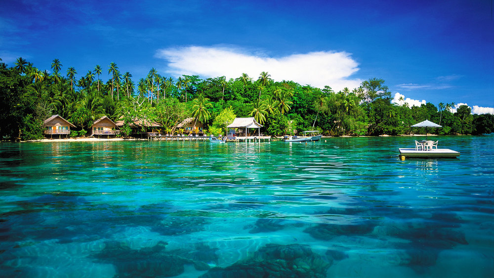 tropical clear waters looking onto beach houses