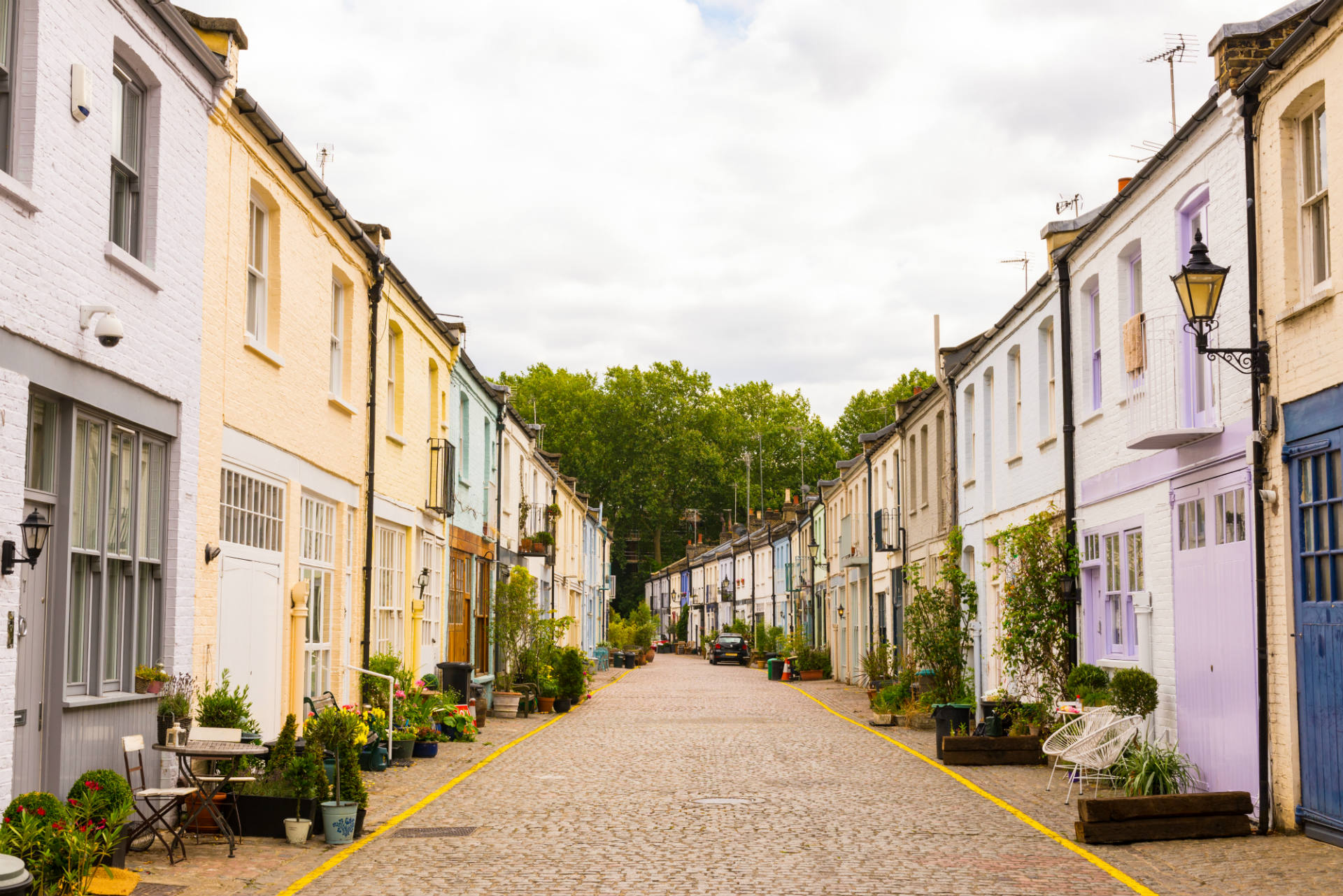 quaint and colourful street full of attached houses 