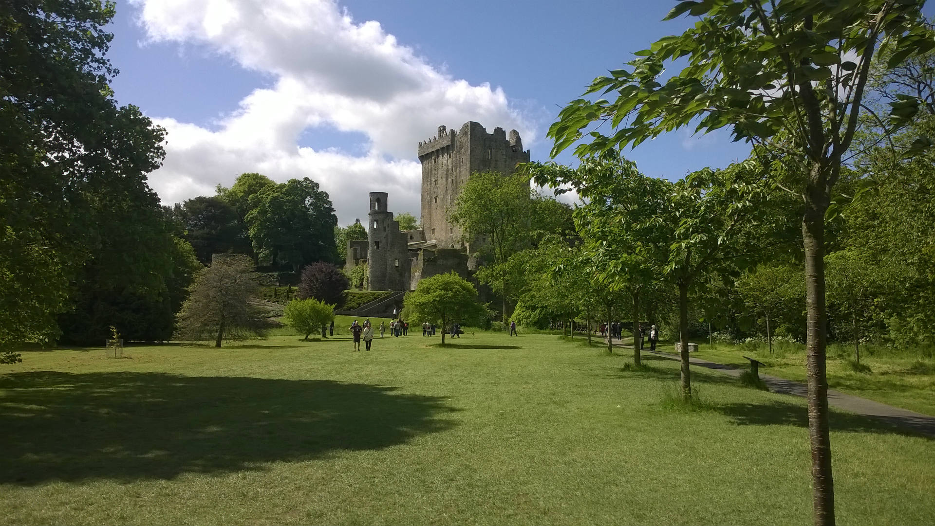 park with historic castle in background