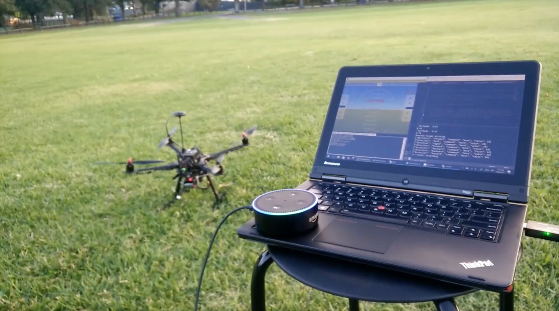 drone and amazon echo next to a laptop