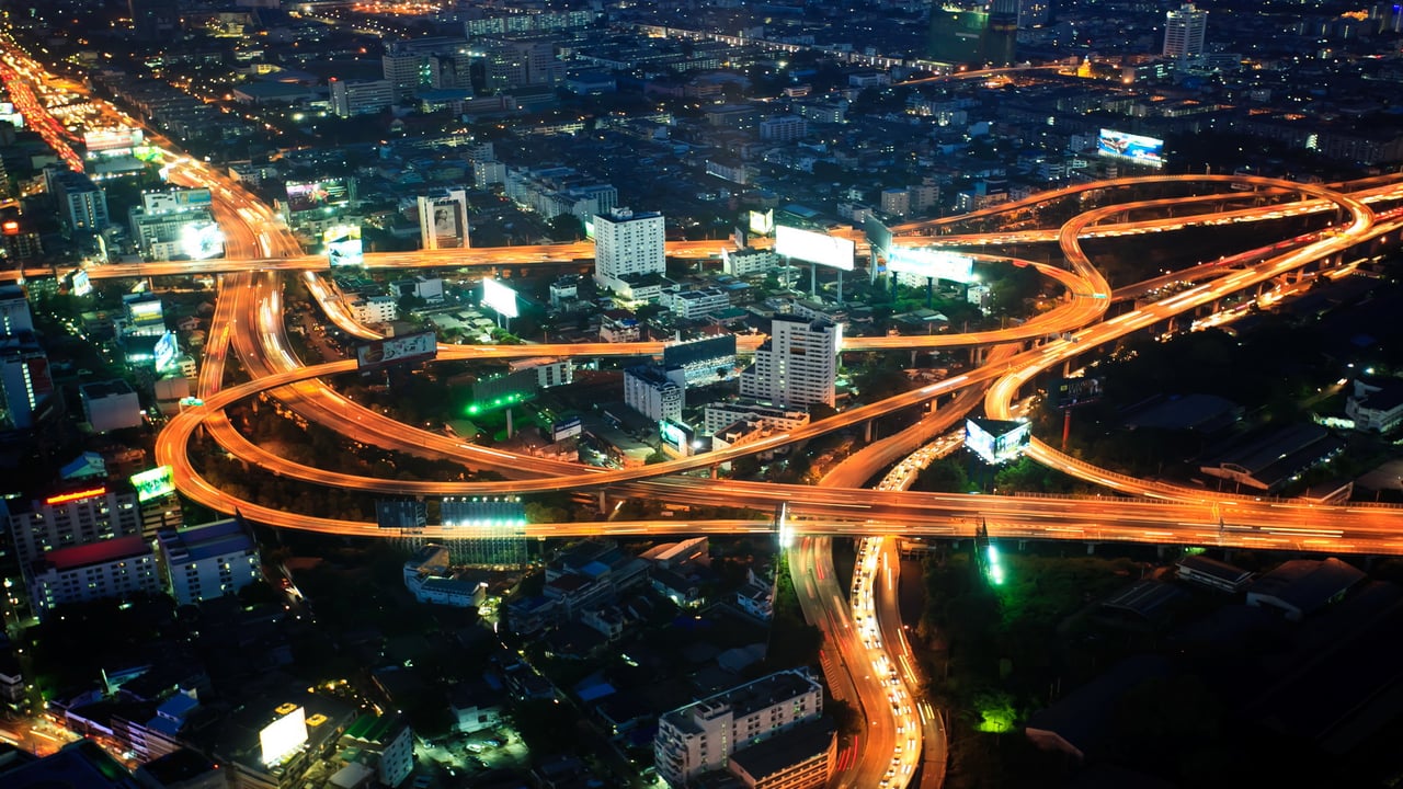 cars light up motorway in a city