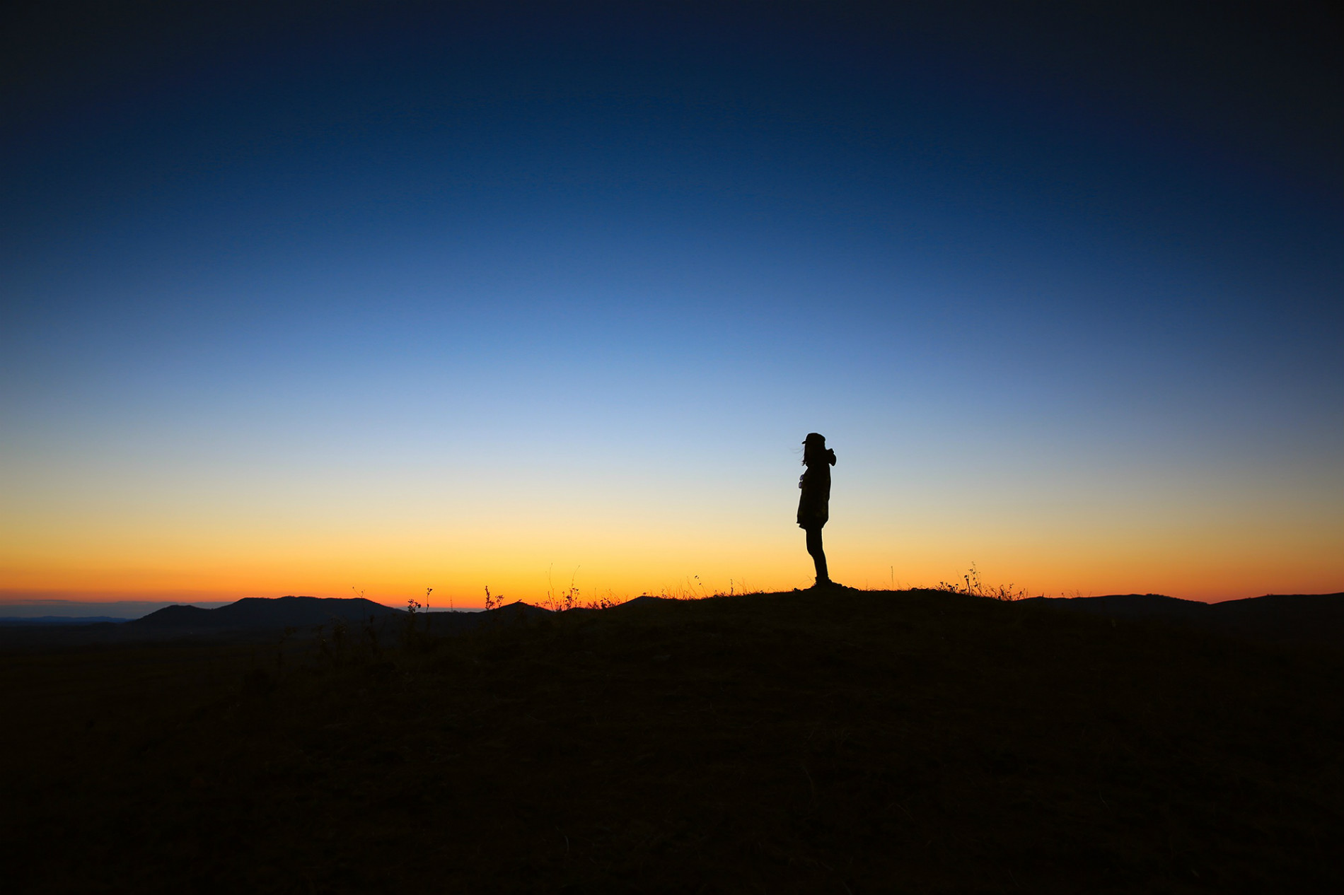 view of late sunset and person standing