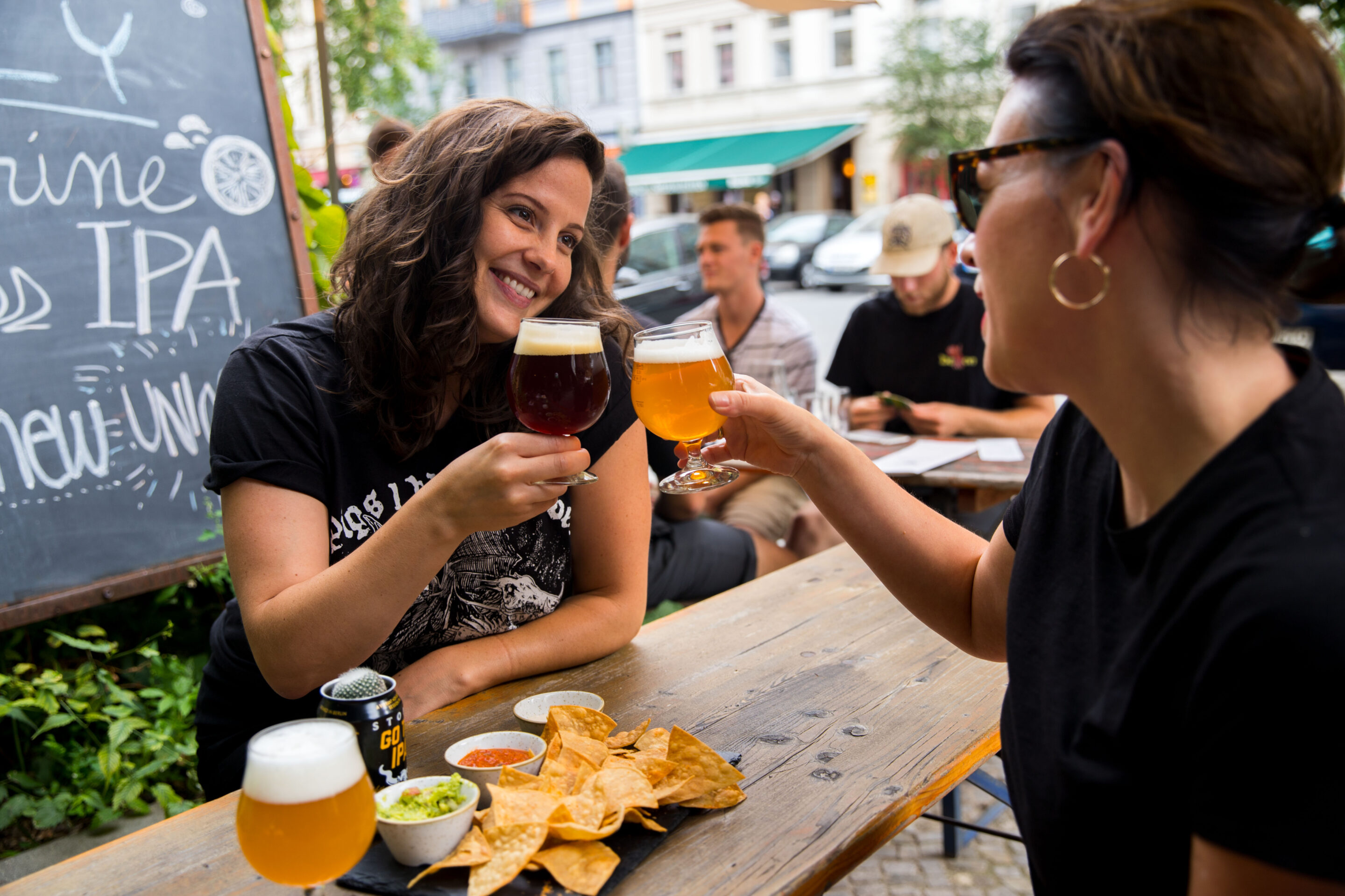 two friends rising a glass of beer