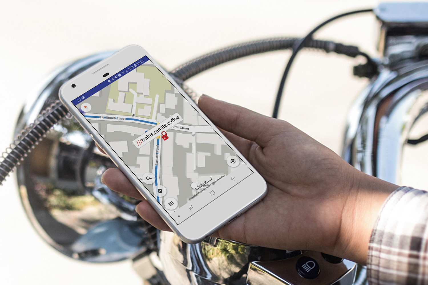 man holding smartphone using what 3 words app