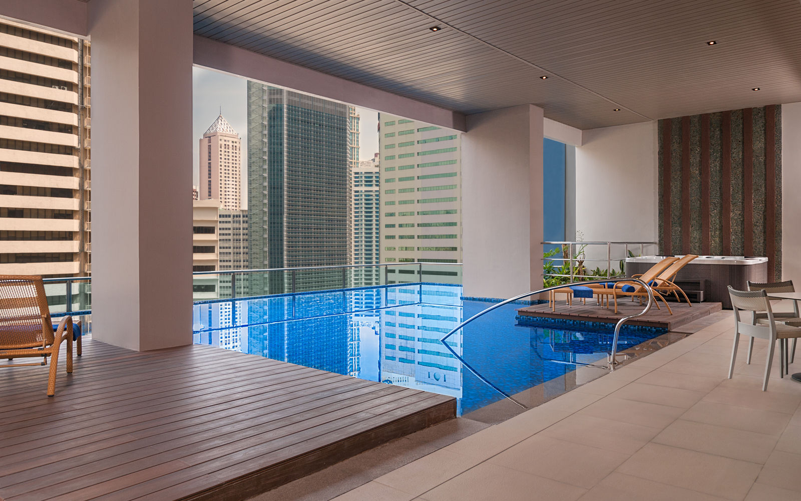 spa with pool overlooking city landscape