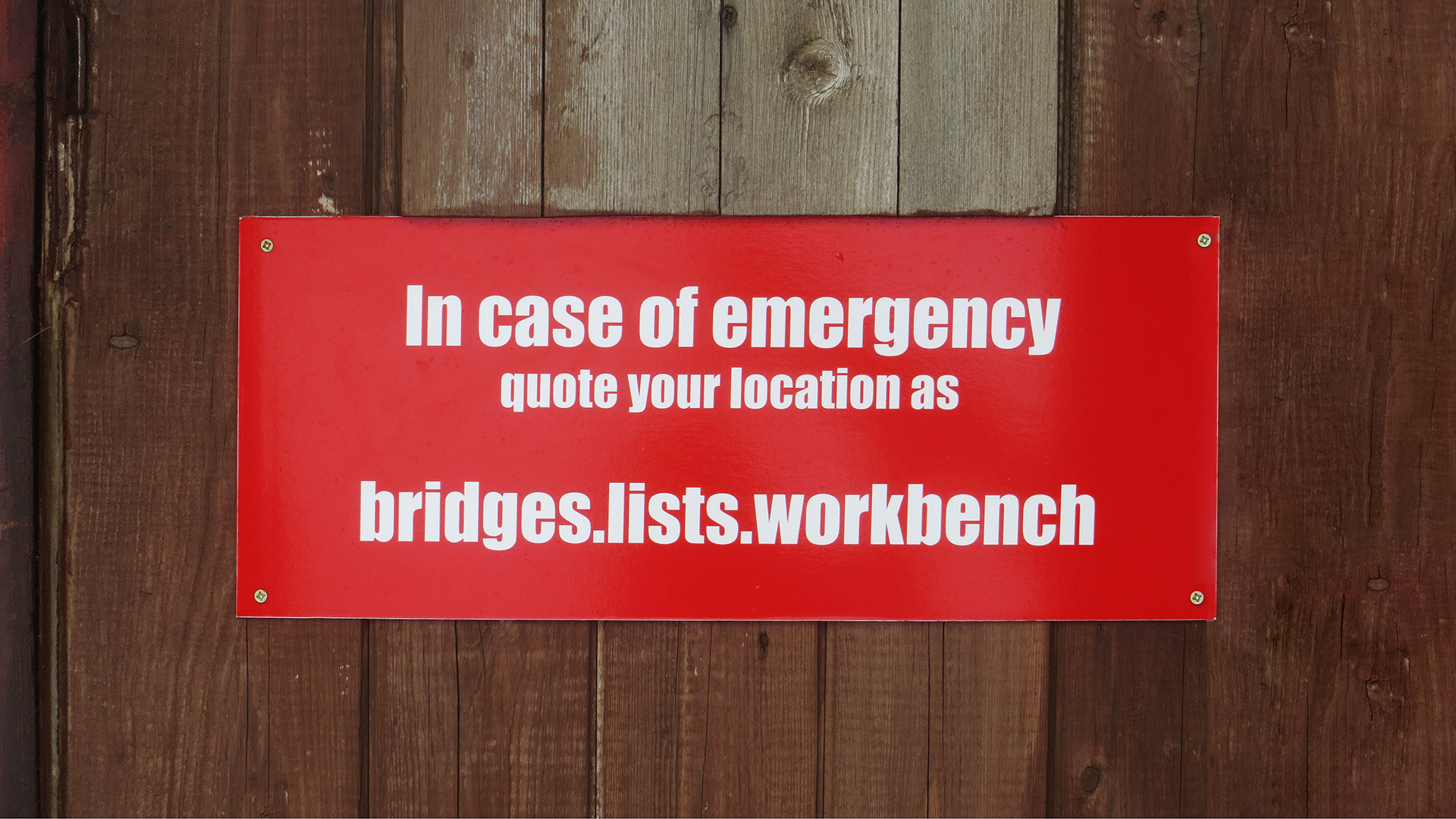 In case of emergency sign with 3 word address attached to fence