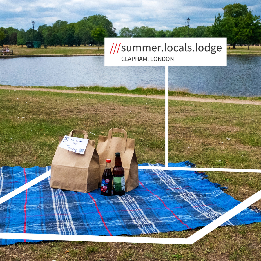 paper bags on a picnic blanket with what3words address summer.locals.lodge